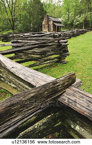 Stock Photograph - A fence and cabin in Smoky Mountain National Park. Fotosearch