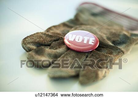 A glove with a Vote button on it View Large Photo Image Picture - A glove with a Vote button on it. Fotosearch