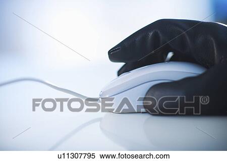 A gloved hand on a computer mouse View Large Photo Image Stock Photography - A gloved hand on a computer mouse. Fotosearch