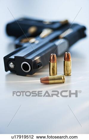 A handgun and ammunition View Large Photo Image Stock Image - A handgun and ammunition. Fotosearch