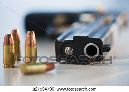 A handgun and ammunition View Large Photo Image Stock Image - A handgun and ammunition. Fotosearch