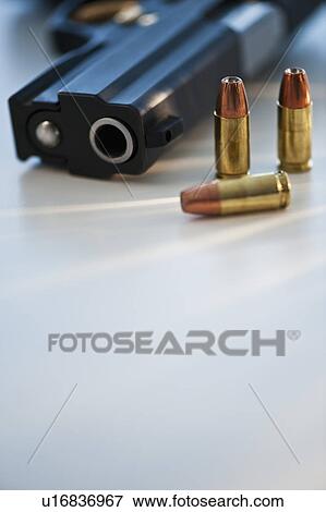 A handgun and ammunition View Large Photo Image Stock Photo - A handgun and ammunition. Fotosearch