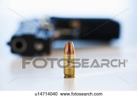 A handgun with ammunition View Large Photo Image Stock Image - A handgun with ammunition. Fotosearch