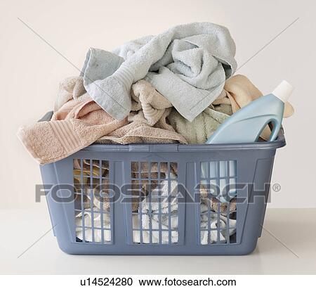 A laundry basket full of towels View Large Photo Image Stock Image - A laundry basket full of towels. Fotosearch