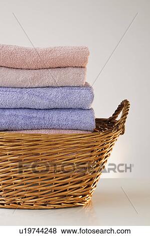 A laundry basket full of towels View Large Photo Image Stock Photo - A laundry basket full of towels. Fotosearch