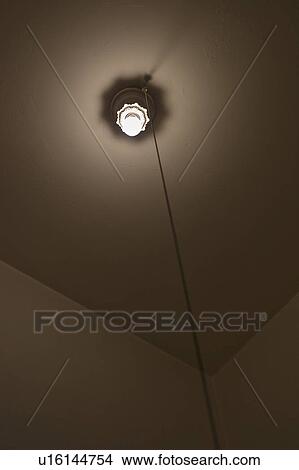 A lightbulb in a room View Large Photo Image Picture - A lightbulb in a room. Fotosearch