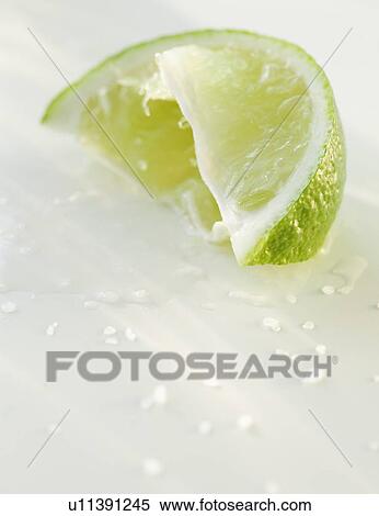 A lime wedge View Large Photo Image Stock Photography - A lime wedge. Fotosearch