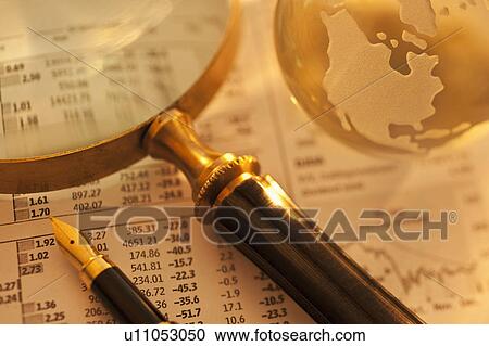 A magnifying glass globe and pen on paperwork View Large Photo Image Stock Image - A magnifying glass globe and pen on paperwork. Fotosearch