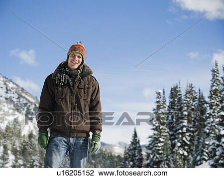 A man outdoors in snowy surroundings View Large Photo Image Stock Image - A man outdoors in snowy surroundings. Fotosearch