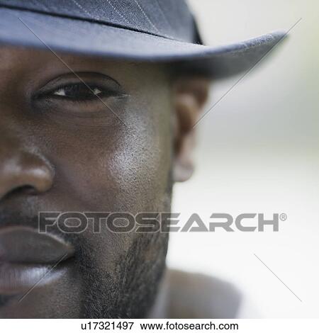 A man outdoors wearing a hat View Large Photo Image Stock Photo - A man outdoors wearing a hat. Fotosearch