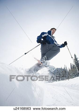 A man snow shoeing View Large Photo Image Stock Image - A man snow shoeing. Fotosearch