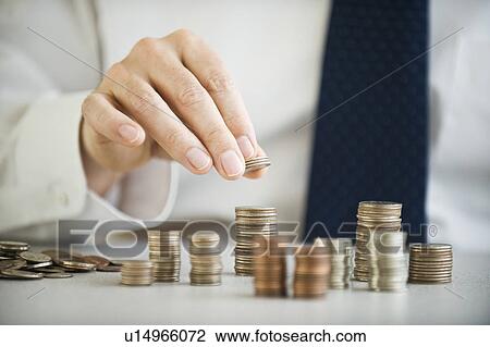 A man sorting change View Large Photo Image Stock Image - A man sorting change. Fotosearch