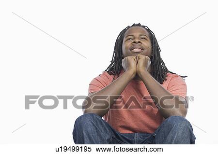 Stock Photography - A man thinking and smiling. Fotosearch