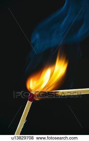 A match lighting another match View Large Photo Image Stock Photo - A match lighting another match. Fotosearch