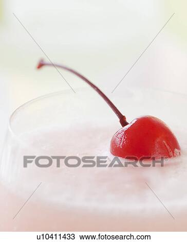 Stock Image - A milkshake with a cherry. Fotosearch