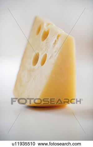 A piece of gruyere cheese View Large Photo Image Stock Image - A piece of gruyere cheese. Fotosearch