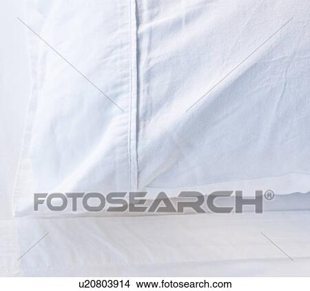 Picture - A pillow in a bed. Fotosearch