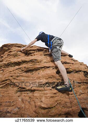 Stock Photo - A rock climber at Red Rock. Fotosearch