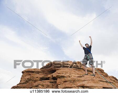Stock Photograph - A rock climber at Red Rock. Fotosearch