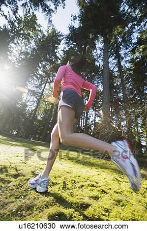 A runner in the woods View Large Photo Image Stock Image - A runner in the woods. Fotosearch