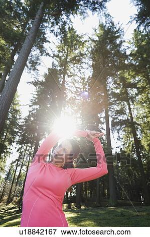 Stock Photo - A runner in the woods. Fotosearch