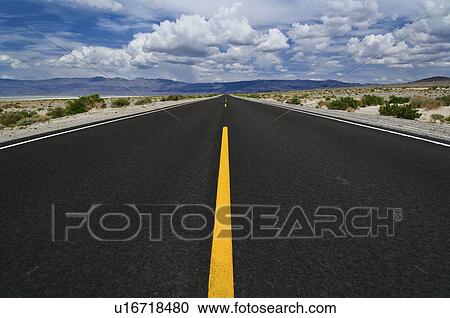 Stock Image - A scenic and empty road. Fotosearch