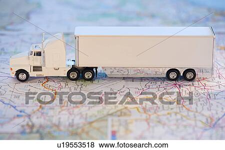 Stock Photo - A toy truck on a map. Fotosearch