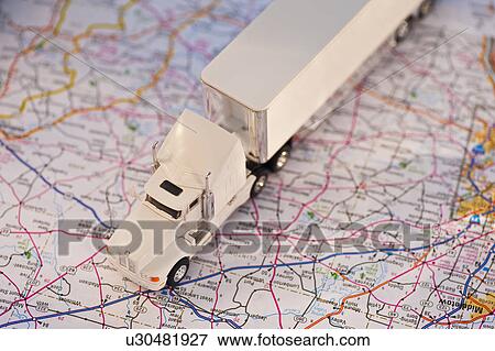 Stock Photo - A toy truck on a map. Fotosearch