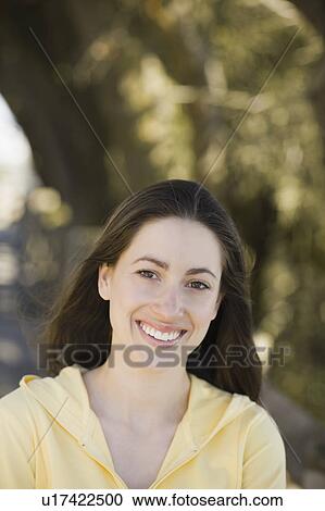 A woman at a park View Large Photo Image Stock Image - A woman at a park. Fotosearch