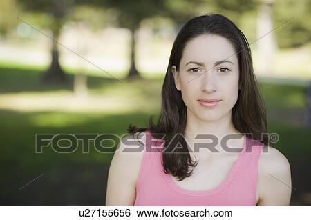 A woman at a park View Large Photo Image Stock Photograph - A woman at a park. Fotosearch