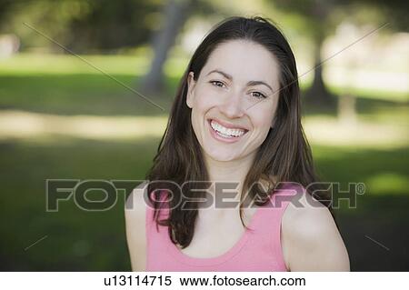 A woman at a park View Large Photo Image Stock Photography - A woman at a park. Fotosearch