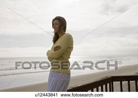Stock Image - A woman at the beach. Fotosearch