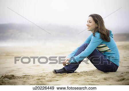 A woman at the beach View Large Photo Image Stock Photo - A woman at the beach. Fotosearch
