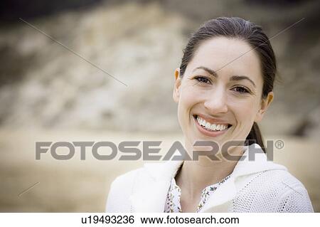 Stock Photograph - A woman at the beach. Fotosearch