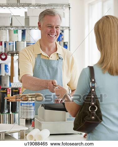A woman buying paint View Large Photo Image Stock Photography - A woman buying paint. Fotosearch