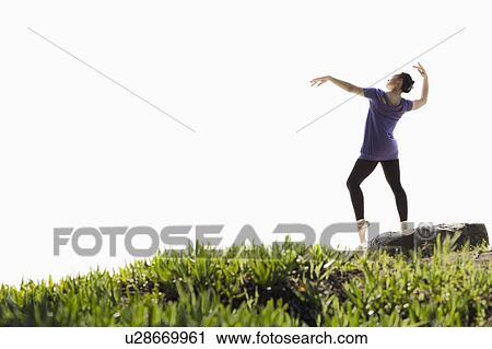 A woman dancing outdoors View Large Photo Image Stock Image - A woman dancing outdoors. Fotosearch