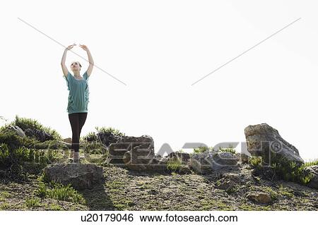 A woman dancing outdoors View Large Photo Image Stock Photograph - A woman dancing outdoors. Fotosearch