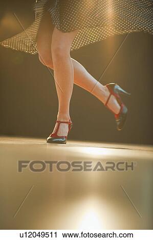 Stock Image - A woman dancing. Fotosearch