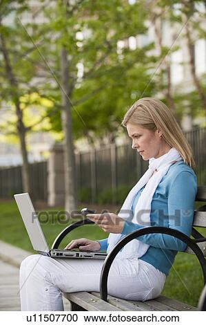 A woman in the park View Large Photo Image Stock Image - A woman in the park. Fotosearch