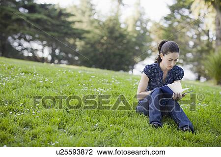 Stock Image - A woman in the park. Fotosearch