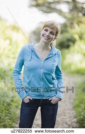 A woman on a path in the woods View Large Photo Image Stock Photography - A woman on a path in the woods. Fotosearch