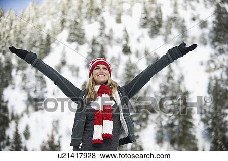 A woman outdoors in snowy surroundings View Large Photo Image Stock Photo - A woman outdoors in snowy surroundings. Fotosearch