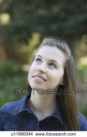 A woman outdoors smiling View Large Photo Image Picture - A woman outdoors smiling. Fotosearch