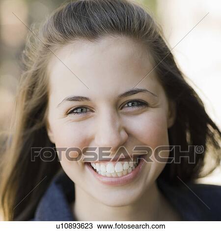 A woman outdoors smiling View Large Photo Image Stock Image - A woman outdoors smiling. Fotosearch