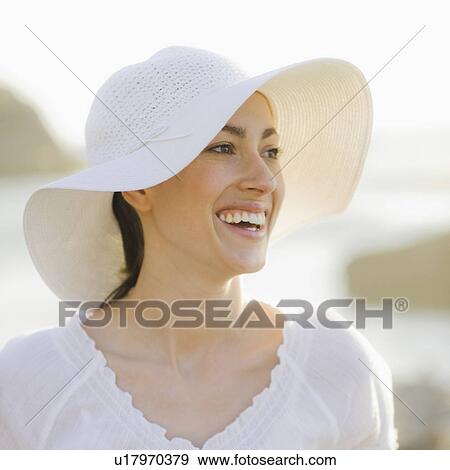 Stock Photo - A woman outdoors smiling. Fotosearch