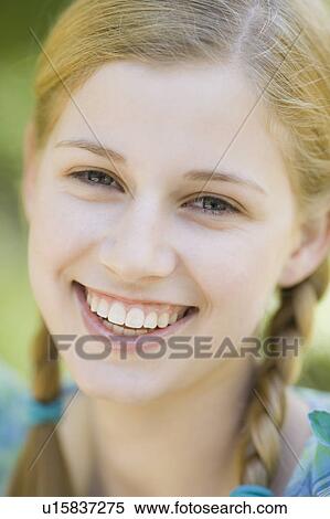 A woman outdoors smiling View Large Photo Image Stock Photography - A woman outdoors smiling. Fotosearch