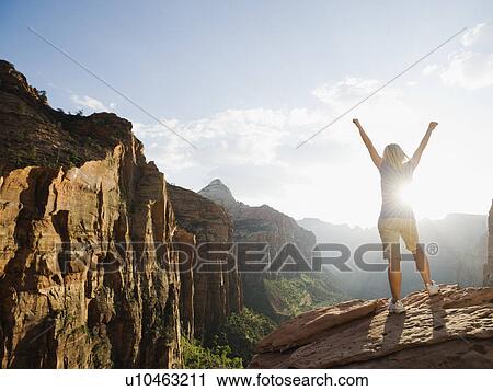 A woman standing at an apex at Red Rock View Large Photo Image Stock Image - A woman standing at an apex at Red Rock. Fotosearch