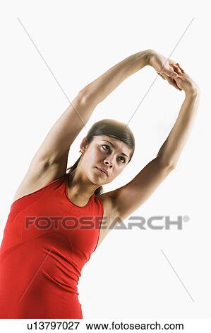 Stock Photo - A woman stretching. Fotosearch