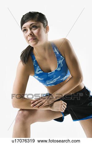 A woman stretching View Large Photo Image Stock Photo - A woman stretching. Fotosearch