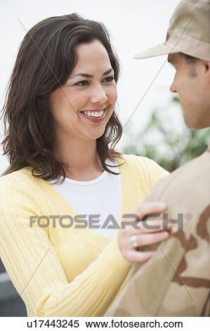 A woman with a military officer View Large Photo Image Stock Photography - A woman with a military officer. Fotosearch
